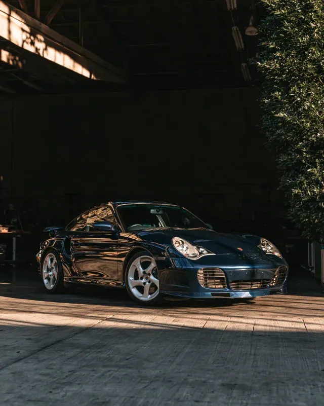 A midnight blue 996 Turbo in the workshop